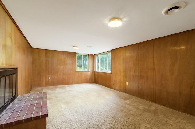 5930 Coonpath Rd NW, Carroll, OH 43112 - spare room featuring carpet floors, wooden walls, and a fireplace