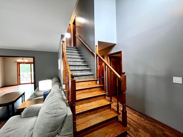 268 Clayburne Blvd, Chillicothe, OH 45601 - stairs with wood finished floors, a chandelier, and a high ceiling