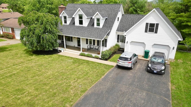 268 Clayburne Blvd, Chillicothe, OH 45601 - cape cod-style house featuring asphalt driveway, a shingled roof, a porch, a chimney, and a front lawn