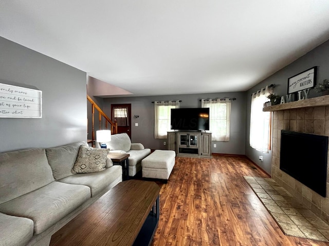 268 Clayburne Blvd, Chillicothe, OH 45601 - living room featuring a fireplace, wood finished floors, and stairs