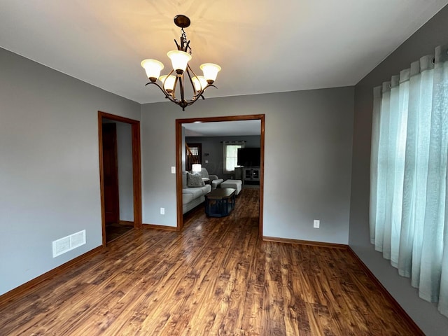 268 Clayburne Blvd, Chillicothe, OH 45601 - spare room featuring wood finished floors and a chandelier