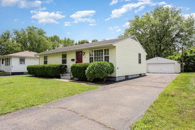 2115 Case Rd, Columbus, OH 43224 - single story home with an outdoor structure, a detached garage, and a front yard