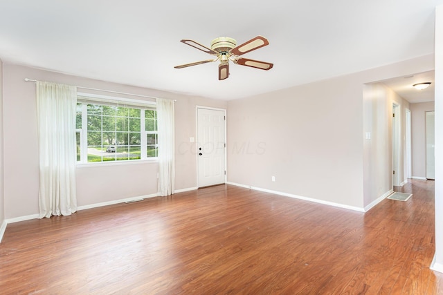 2115 Case Rd, Columbus, OH 43224 - unfurnished living room with ceiling fan and wood finished floors