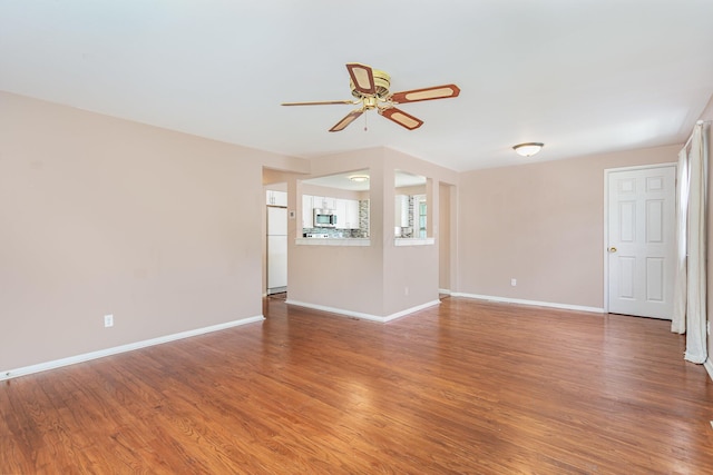 2115 Case Rd, Columbus, OH 43224 - unfurnished living room featuring ceiling fan and wood finished floors