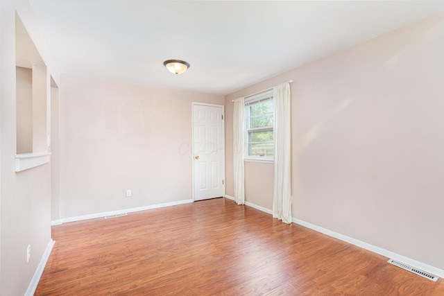 2115 Case Rd, Columbus, OH 43224 - empty room with baseboards and light wood-style flooring