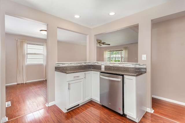 2115 Case Rd, Columbus, OH 43224 - kitchen with dishwasher, white cabinets, dark wood-type flooring, ceiling fan, and recessed lighting
