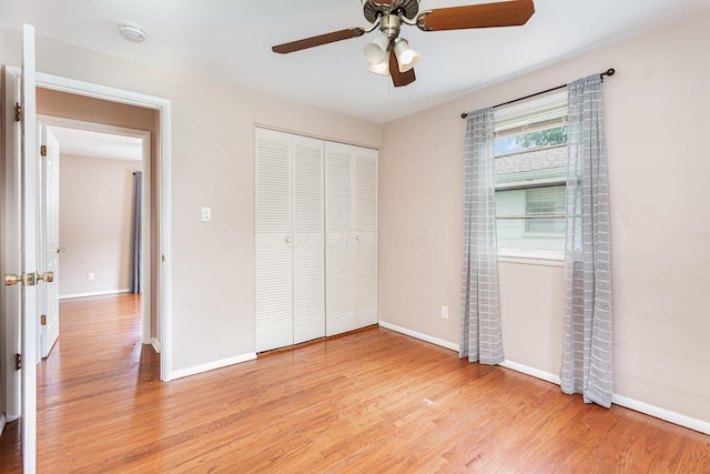 2115 Case Rd, Columbus, OH 43224 - unfurnished bedroom with light wood-style floors, a closet, and ceiling fan