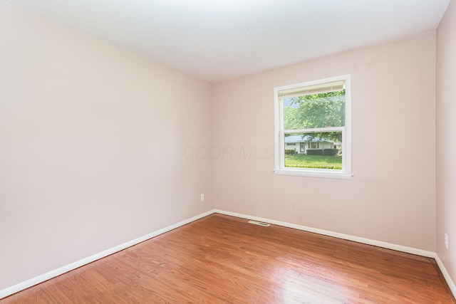 2115 Case Rd, Columbus, OH 43224 - unfurnished room featuring wood finished floors and baseboards