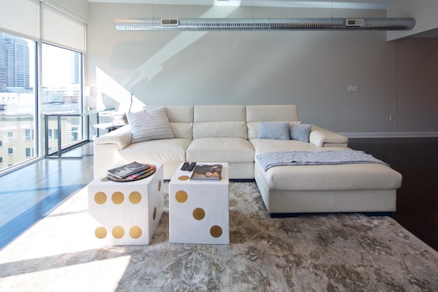 100 E Gay St Unit 804, Columbus, OH 43215 - living room featuring wood finished floors and a wall of windows
