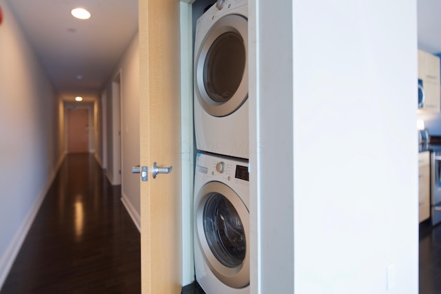 100 E Gay St Unit 804, Columbus, OH 43215 - washroom with stacked washer and clothes dryer, dark wood-style floors, and recessed lighting