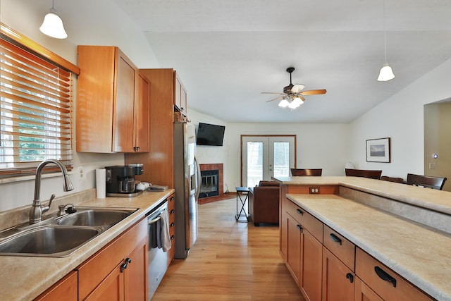3808 Peak Ridge Dr, Columbus, OH 43230 - kitchen with appliances with stainless steel finishes, open floor plan, light wood-style floors, plenty of natural light, and vaulted ceiling
