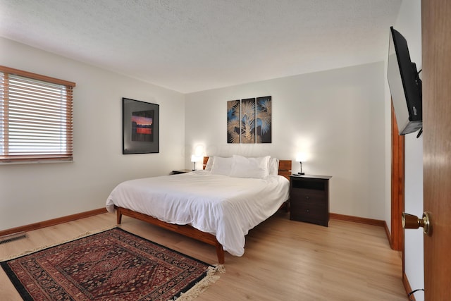 3808 Peak Ridge Dr, Columbus, OH 43230 - bedroom with baseboards and light wood finished floors