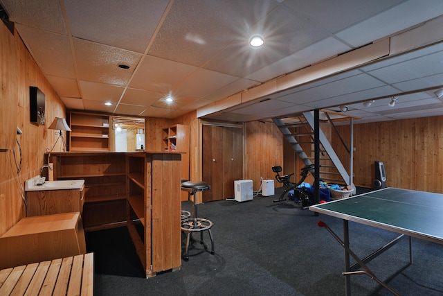 3808 Peak Ridge Dr, Columbus, OH 43230 - game room featuring wood walls, carpet floors, and a paneled ceiling