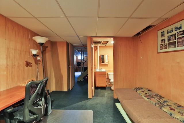 3808 Peak Ridge Dr, Columbus, OH 43230 - finished basement with a drop ceiling, dark carpet, and wood walls