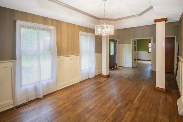 7740 Gale Rd SW, Hebron, OH 43025 - unfurnished dining area featuring wainscoting, hardwood / wood-style flooring, a chandelier, a decorative wall, and plenty of natural light