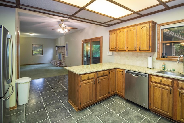 7740 Gale Rd SW, Hebron, OH 43025 - kitchen with appliances with stainless steel finishes, a peninsula, ceiling fan, and dark tile patterned flooring