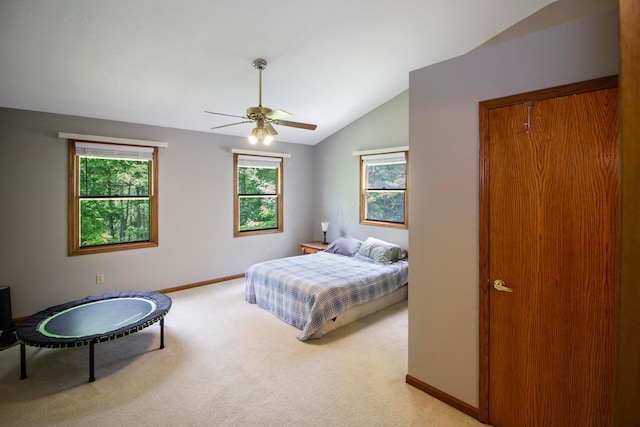 7740 Gale Rd SW, Hebron, OH 43025 - bedroom with light colored carpet, lofted ceiling, multiple windows, and a ceiling fan