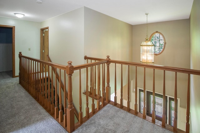 7740 Gale Rd SW, Hebron, OH 43025 - corridor featuring an upstairs landing, carpet, and a chandelier