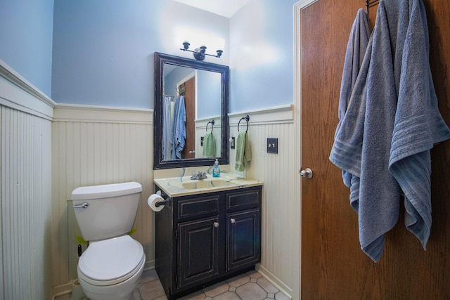 7740 Gale Rd SW, Hebron, OH 43025 - bathroom with wainscoting, vanity, and tile patterned flooring