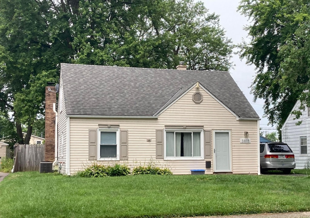 3815 Eisenhower Rd, Columbus, OH 43224 - view of front of house with a chimney and roof with shingles