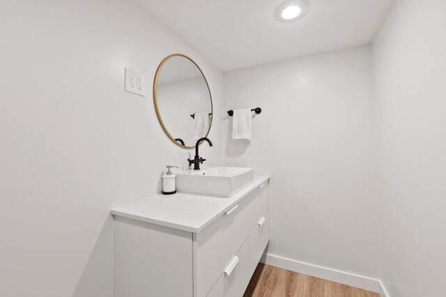 2560 Zollinger Rd, Columbus, OH 43221 - bathroom with wood finished floors and vanity