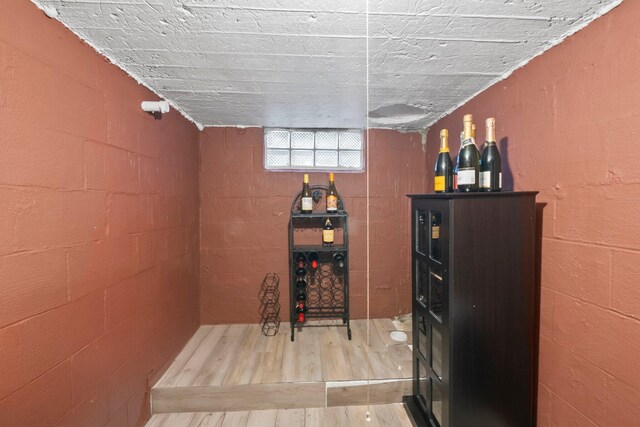 2560 Zollinger Rd, Columbus, OH 43221 - wine cellar with wood finished floors and concrete block wall