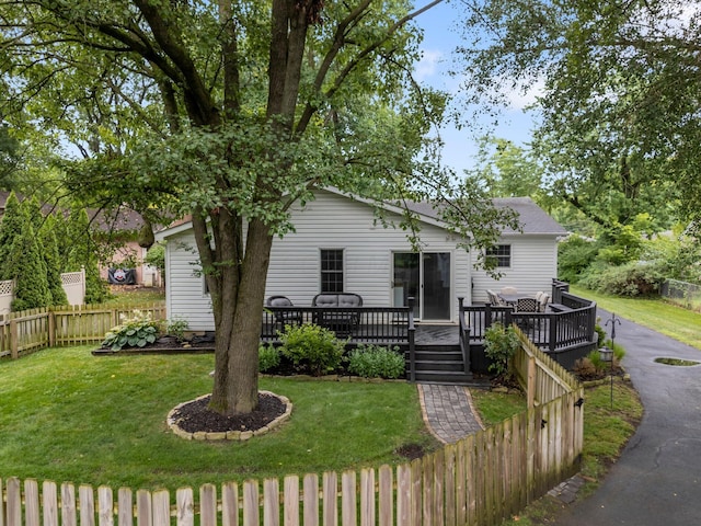 2560 Zollinger Rd, Columbus, OH 43221 - view of front of house with a fenced backyard and a wooden deck