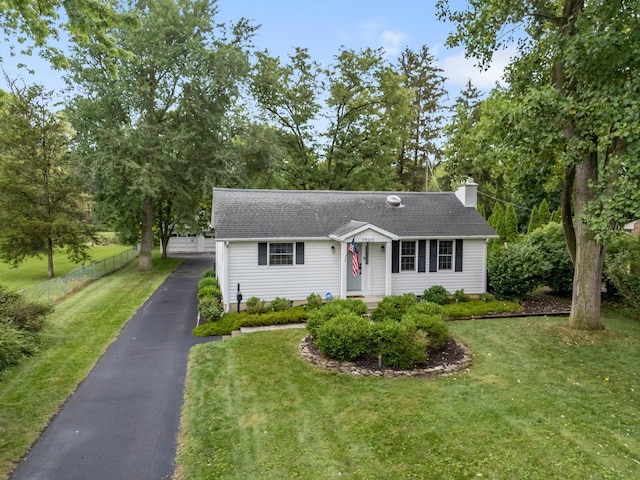 2560 Zollinger Rd, Columbus, OH 43221 - view of front of house featuring a chimney, roof with shingles, and view of wooded area