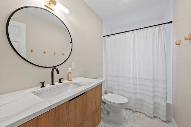 2560 Zollinger Rd, Columbus, OH 43221 - full bath featuring vanity and tile patterned flooring