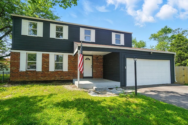 2605 Bella Via Ave, Columbus, OH 43231 - view of front facade featuring driveway, a garage, and brick siding