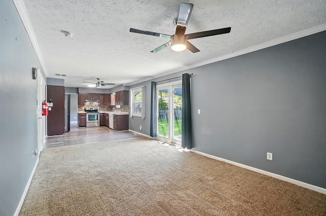 2605 Bella Via Ave, Columbus, OH 43231 - unfurnished living room with a ceiling fan, light colored carpet, a textured ceiling, and crown molding