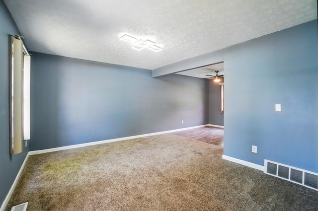 2605 Bella Via Ave, Columbus, OH 43231 - spare room featuring carpet flooring, a textured ceiling, and ceiling fan