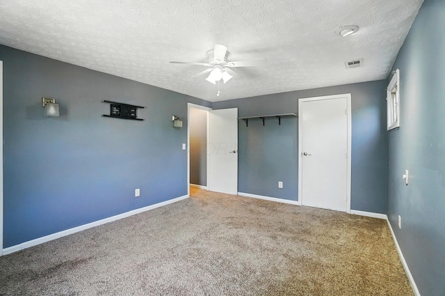 2605 Bella Via Ave, Columbus, OH 43231 - unfurnished bedroom with carpet, a textured ceiling, a closet, and a ceiling fan