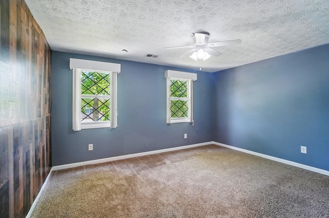 2605 Bella Via Ave, Columbus, OH 43231 - carpeted empty room with a ceiling fan and a textured ceiling