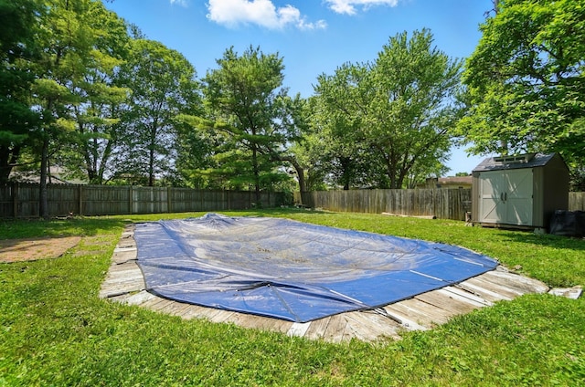 2605 Bella Via Ave, Columbus, OH 43231 - view of swimming pool featuring a storage shed and a fenced backyard