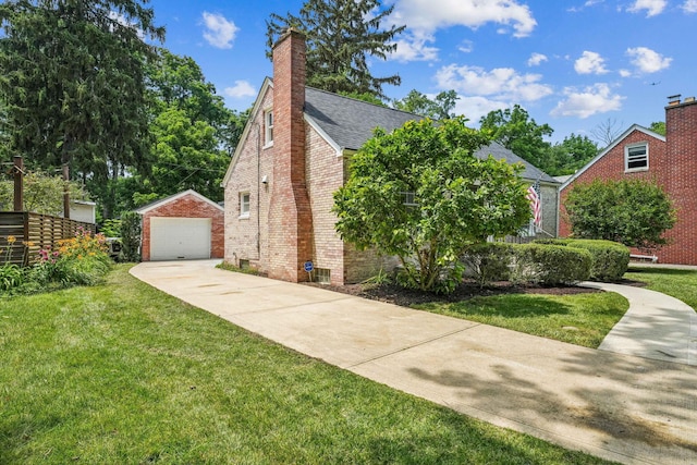 527 N Columbia Ave, Bexley, OH 43209 - view of property exterior featuring an outdoor structure, a detached garage, brick siding, concrete driveway, and a yard