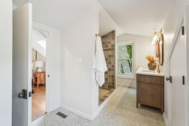 527 N Columbia Ave, Bexley, OH 43209 - full bathroom featuring vanity, a tile shower, and vaulted ceiling