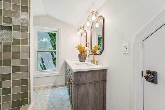 527 N Columbia Ave, Bexley, OH 43209 - bathroom featuring vanity, lofted ceiling, and a tile shower