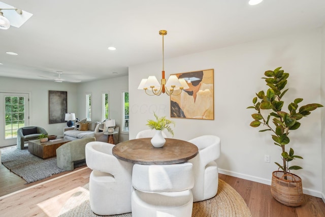 527 N Columbia Ave, Bexley, OH 43209 - dining room featuring healthy amount of natural light, wood finished floors, recessed lighting, a chandelier, and a skylight