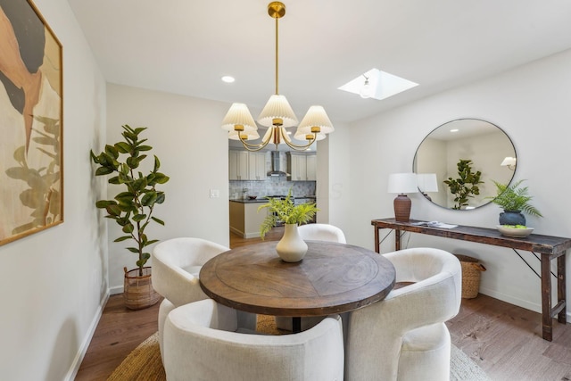 527 N Columbia Ave, Bexley, OH 43209 - dining space featuring a skylight, a chandelier, light wood-style flooring, and recessed lighting