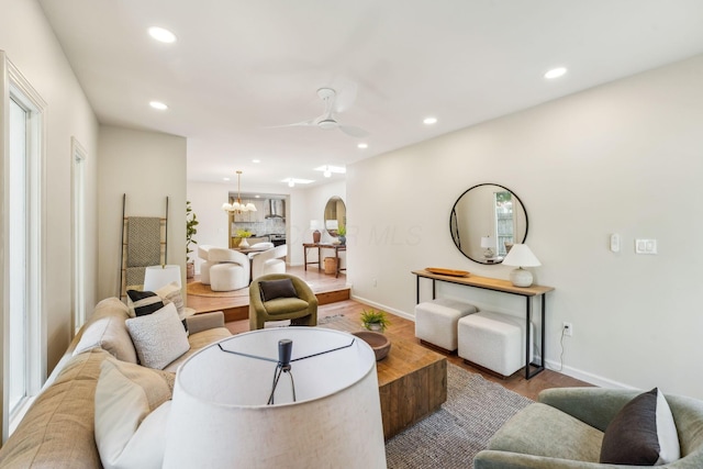 527 N Columbia Ave, Bexley, OH 43209 - living area featuring wood finished floors, recessed lighting, a ceiling fan, arched walkways, and a chandelier