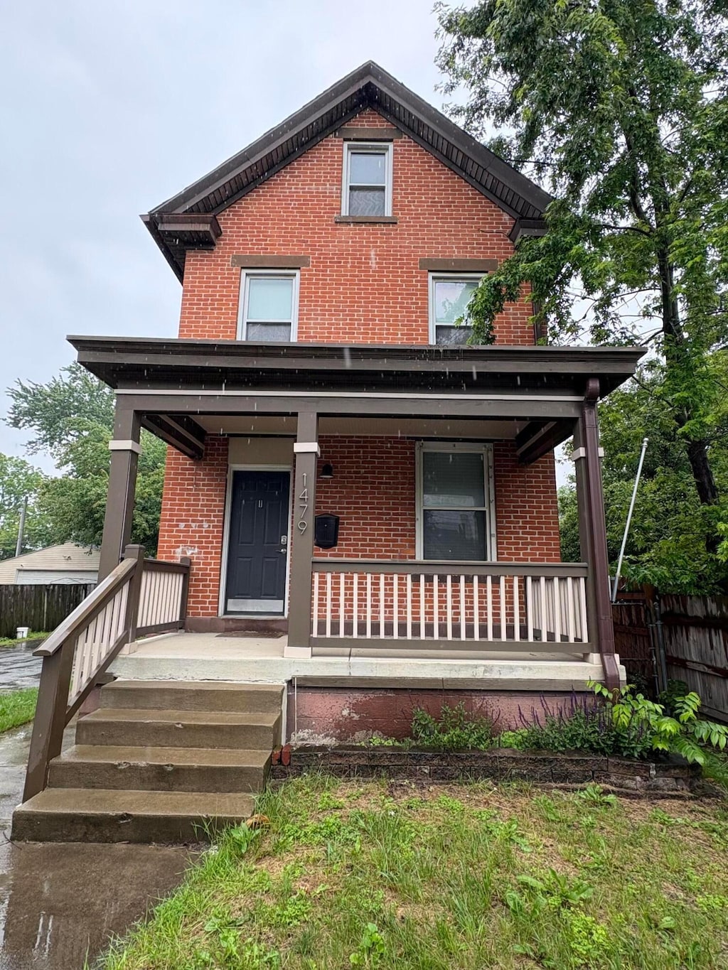 1479 Lockbourne Rd, Columbus, OH 43206 - american foursquare style home featuring brick siding and a porch