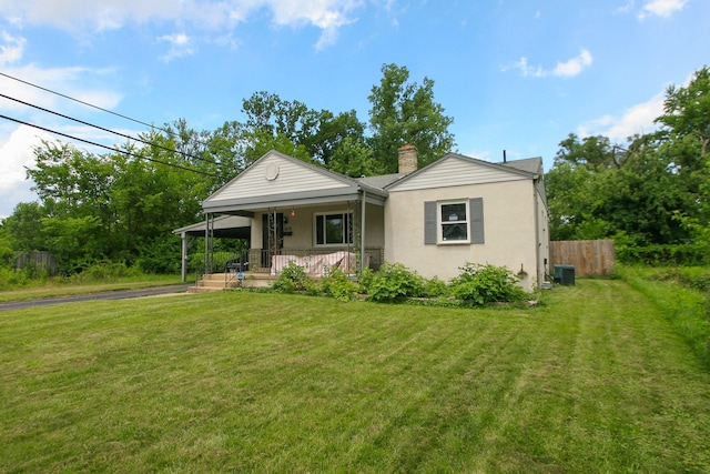 1810 Lehner Rd, Columbus, OH 43224 - view of front of house with covered porch, a chimney, and stucco siding