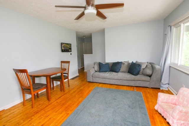 1810 Lehner Rd, Columbus, OH 43224 - living area featuring ceiling fan, light wood-type flooring, and a textured ceiling