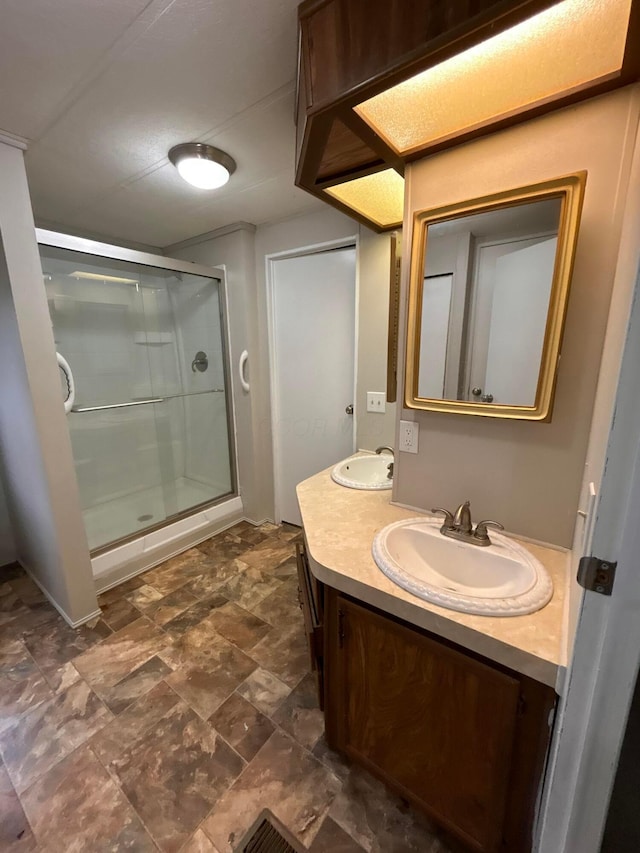 110 E Hickory Grove Rd Unit 45, Urbana, OH 43078 - full bath featuring double vanity, a shower stall, and stone finish flooring