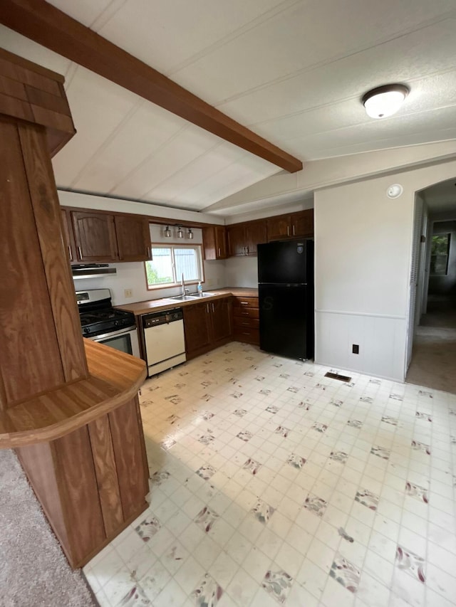 110 E Hickory Grove Rd Unit 45, Urbana, OH 43078 - kitchen with freestanding refrigerator, dishwasher, stainless steel gas stove, light floors, and dark brown cabinetry