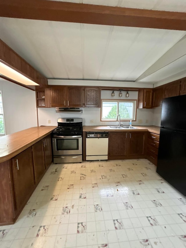 110 E Hickory Grove Rd Unit 45, Urbana, OH 43078 - kitchen with stainless steel gas range, white dishwasher, freestanding refrigerator, light floors, and under cabinet range hood