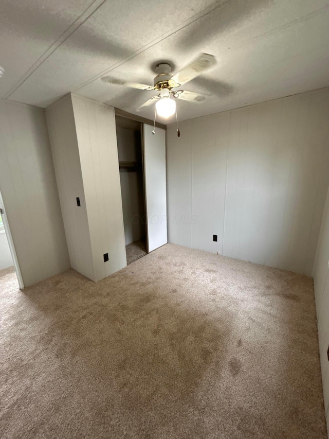 110 E Hickory Grove Rd Unit 45, Urbana, OH 43078 - unfurnished bedroom with carpet flooring, a closet, and a ceiling fan