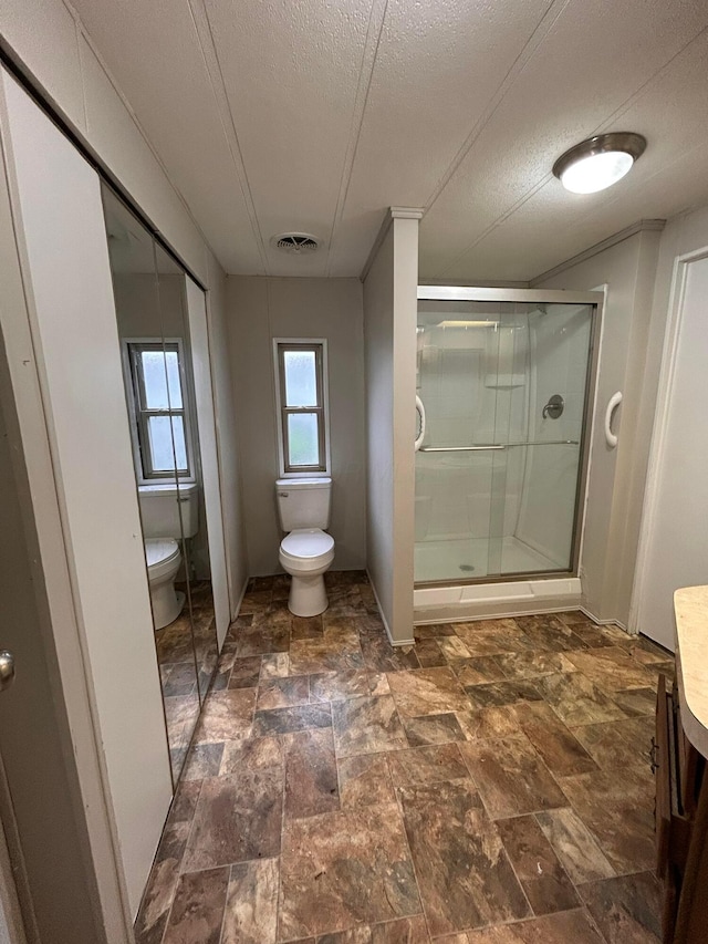 110 E Hickory Grove Rd Unit 45, Urbana, OH 43078 - full bathroom with a shower stall, stone finish floors, vanity, and a textured ceiling