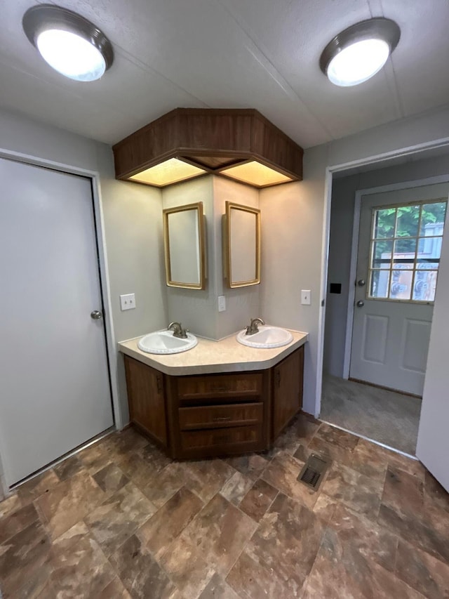 110 E Hickory Grove Rd Unit 45, Urbana, OH 43078 - bathroom with double vanity and stone finish floors